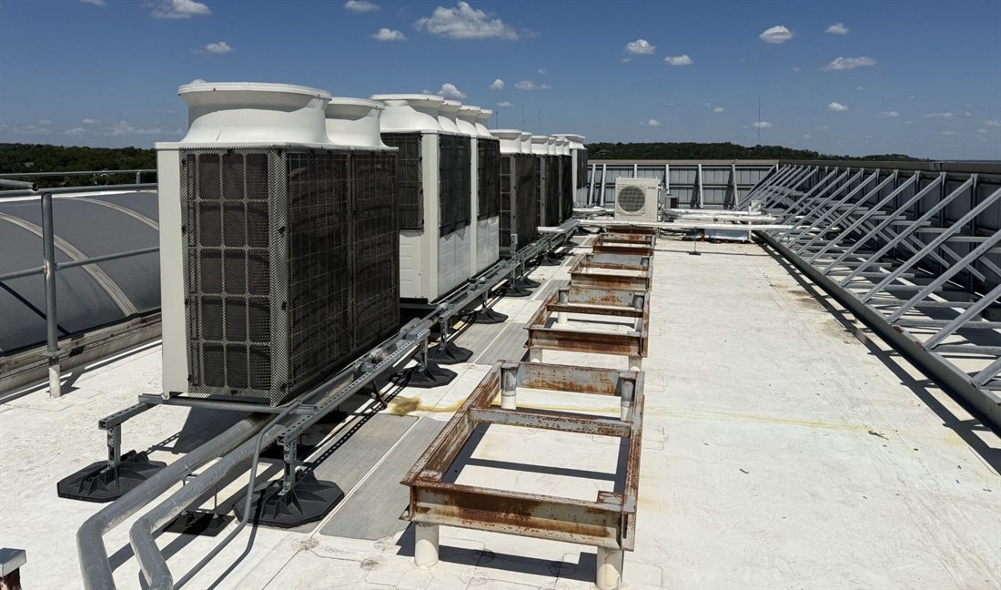 Row of VRF condensing units installed by 512 Mechanical on a commercial rooftop in Austin, Texas